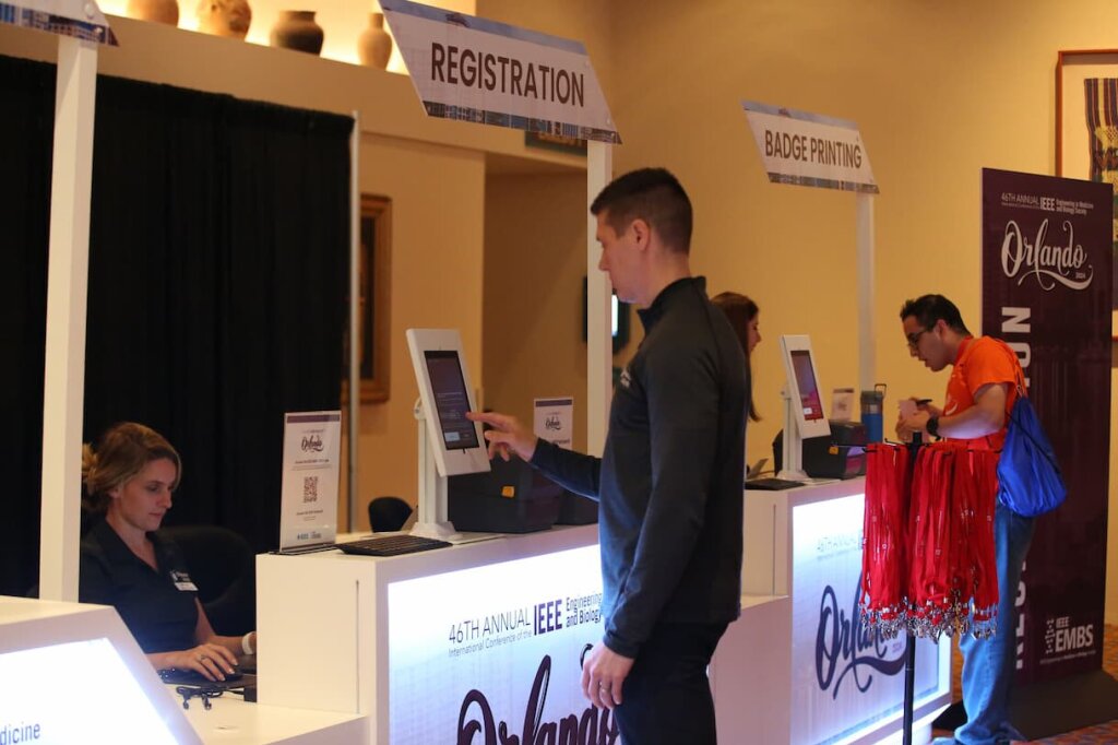 Attendee at a registration desk.