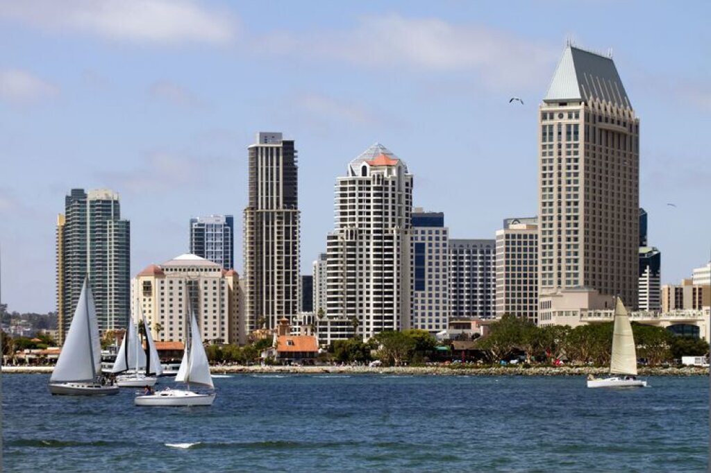 San Diego skyline during the day with sailboats in the foreground.